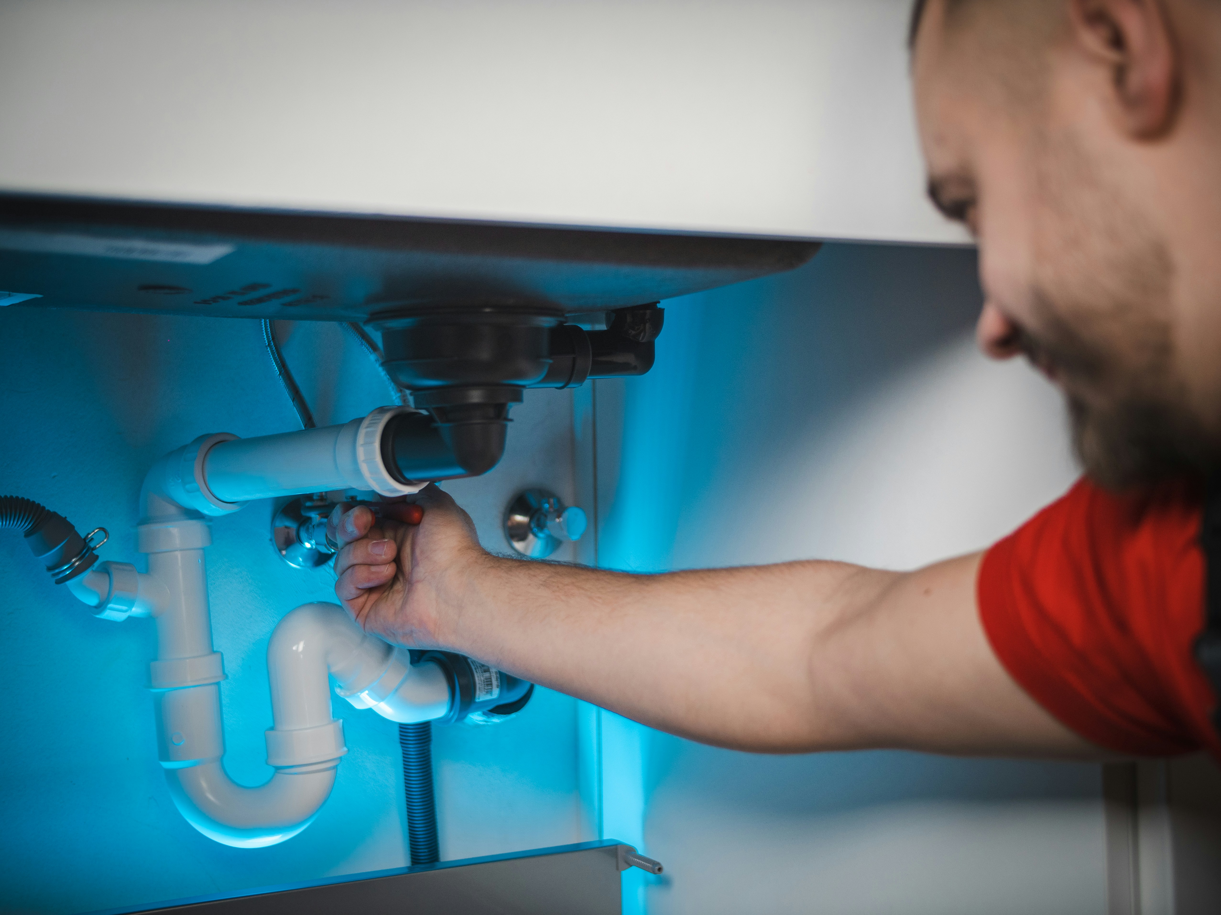 Professional plumber at work